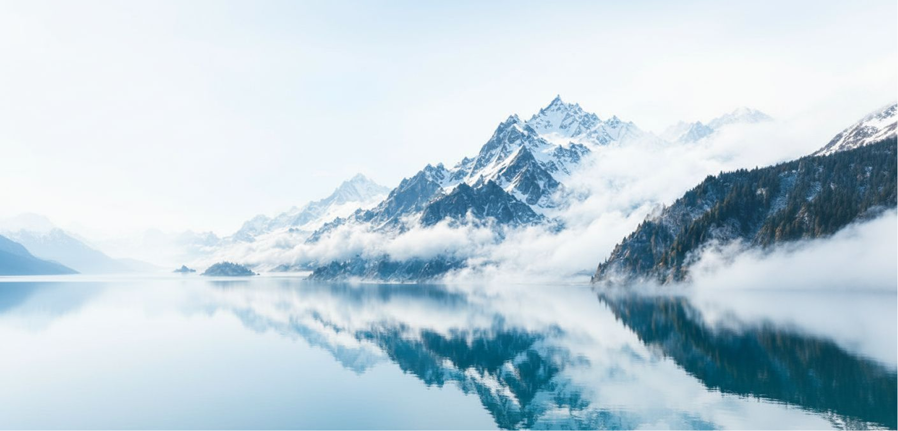 Snow-capped mountain reflected in a calm lake